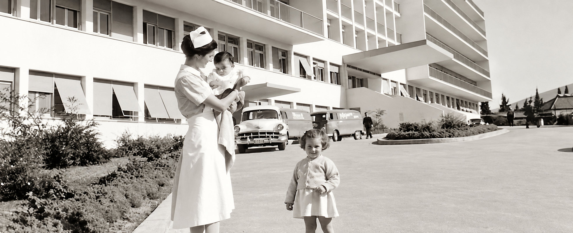 Nurse holding a child in hospital