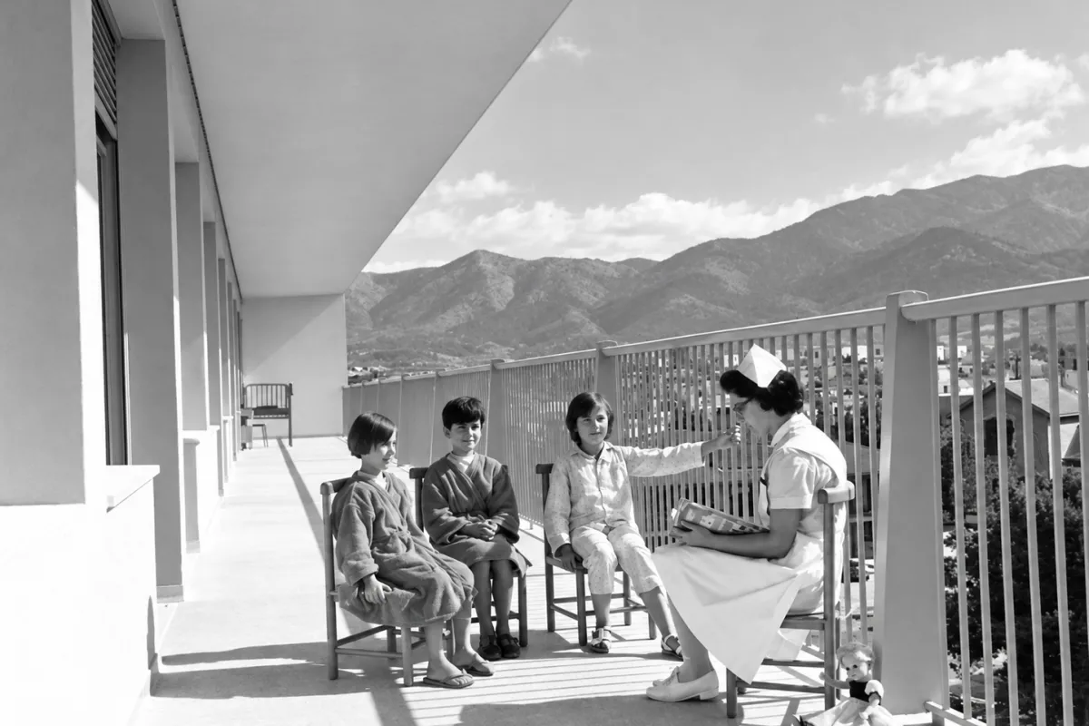 Old Photo of Nurse reading a book 
